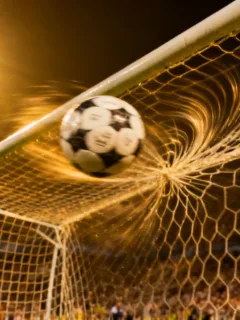 Football hitting net, game-winning moment, European league match