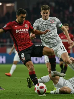 Crucial defensive tackle in a European football match