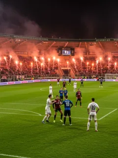Electrifying European derby atmosphere with passionate fans and clashing players